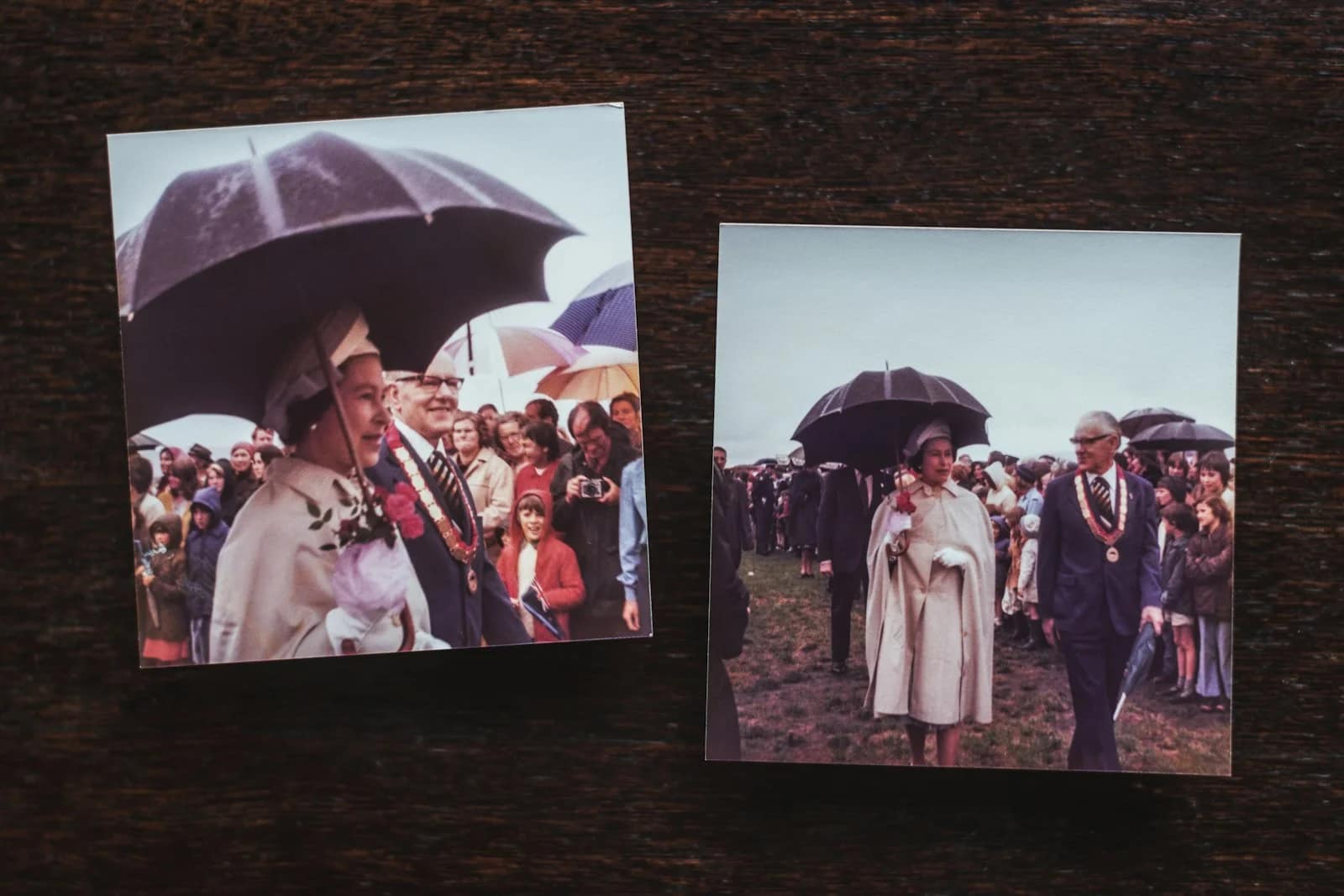 a group of people holding umbrellas a group of people holding umbrellas